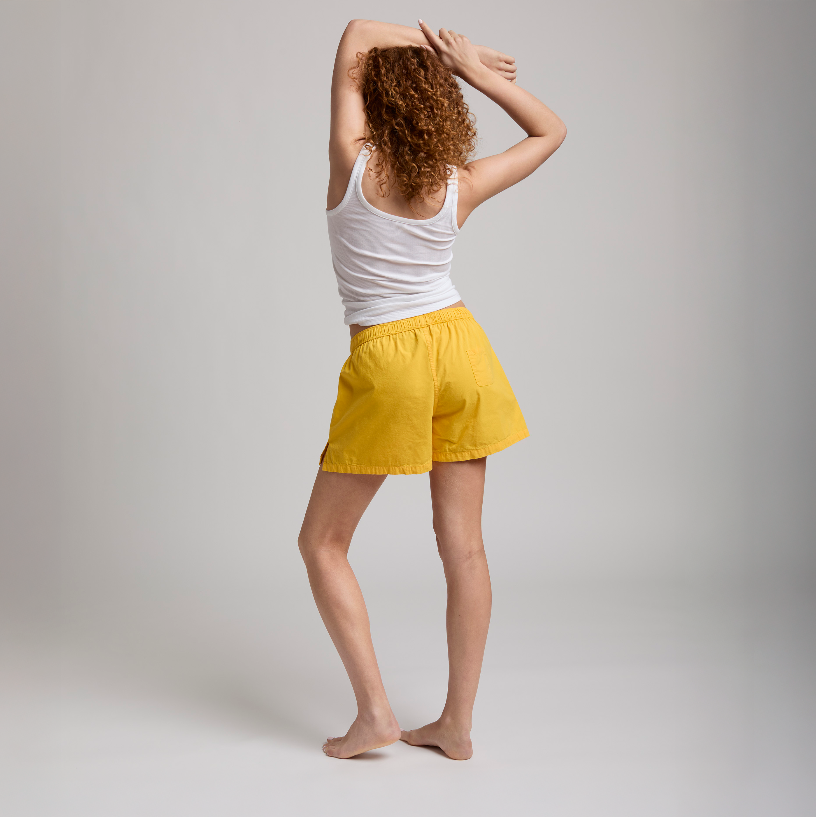 color_Yellow - Model with back to camera wearing The Bye Boxer in yellow
