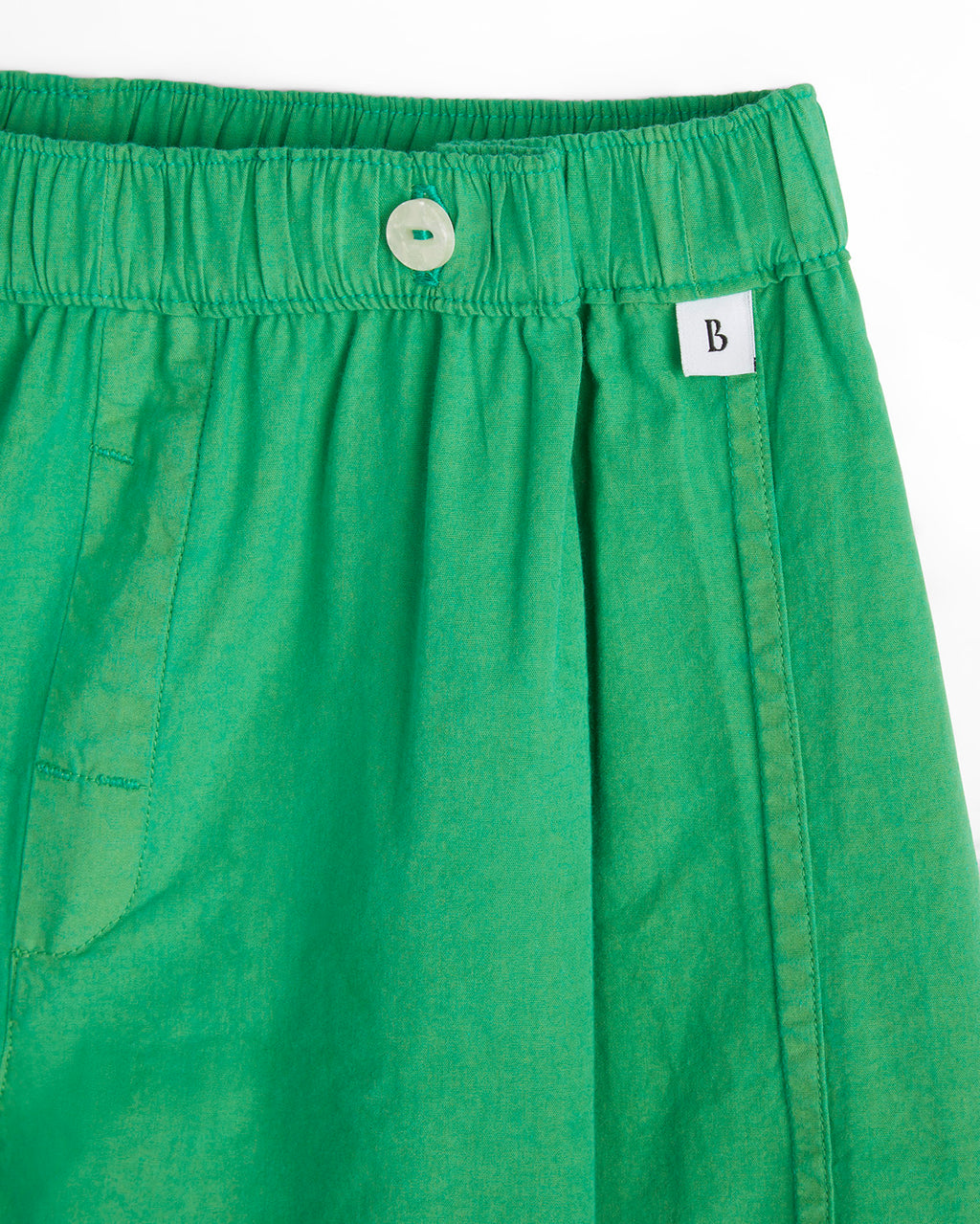 Closeup of Bye Boxers logo on green shorts